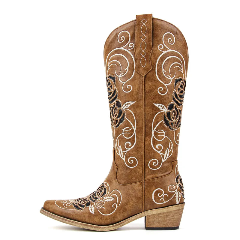 Brown cowboy boot with floral embroidery on a white background