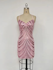 Pink sequin dress on a mannequin against a white background