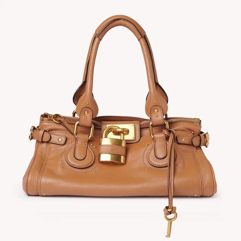 light brown metallic finish handbag with signature key accent