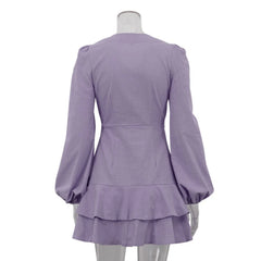 Purple dress with ruffled skirt on a mannequin against a white background