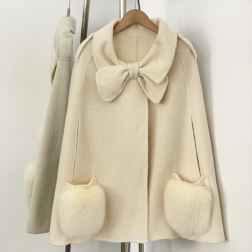 Beige cape coat with bow and fur pockets