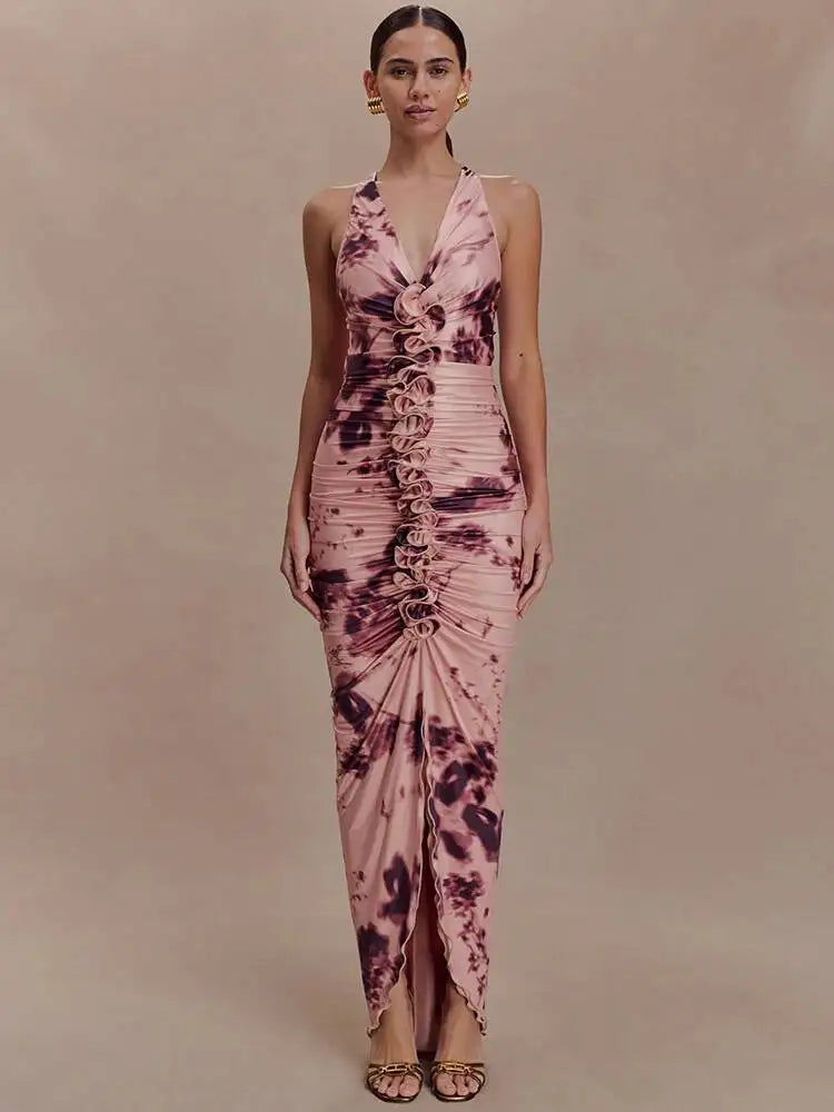 Woman wearing a pink and purple tie-dye dress against a beige background