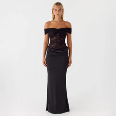 Woman wearing a black off-shoulder evening gown on a white background