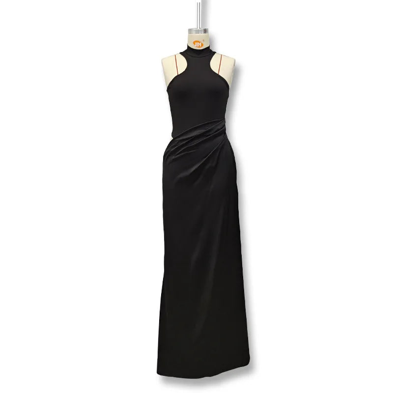 Black evening gown on a mannequin against a white background