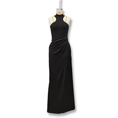 Black evening gown on a mannequin against a white background