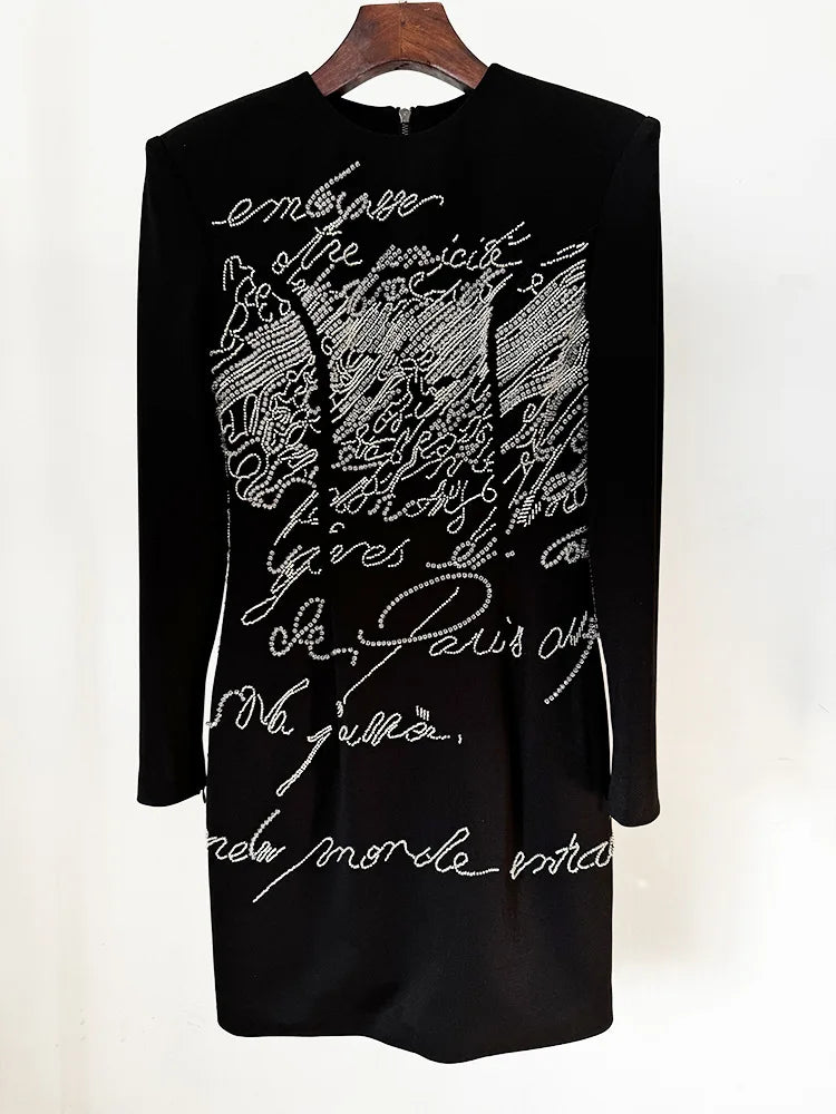 Black beaded script long sleeve mini dress on hanger