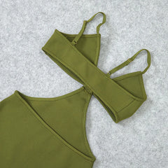 Green bikini set on a light gray textured background