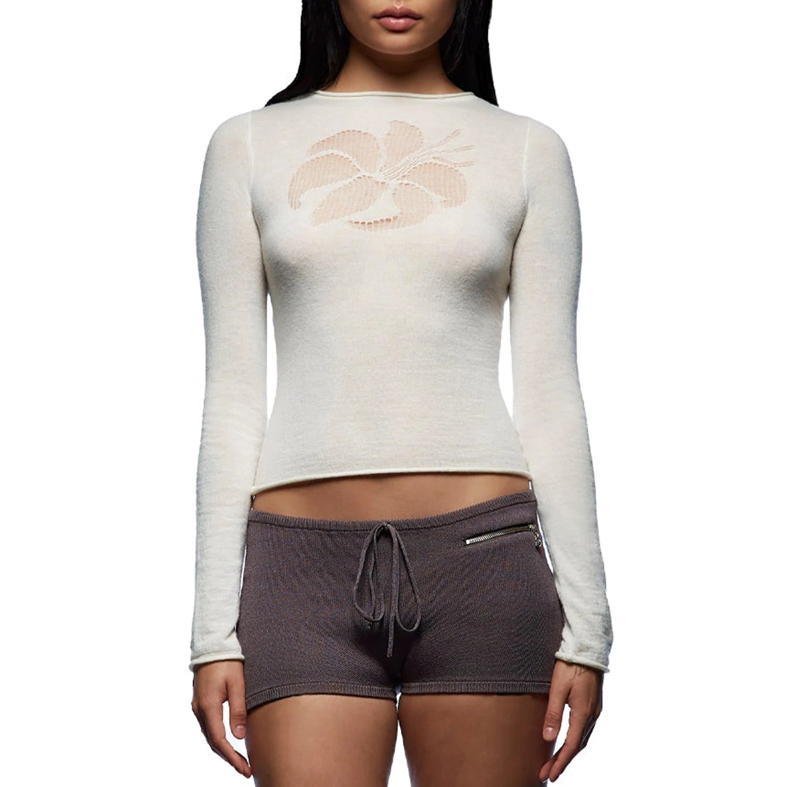 Person wearing a white long-sleeve top with a gray shorts