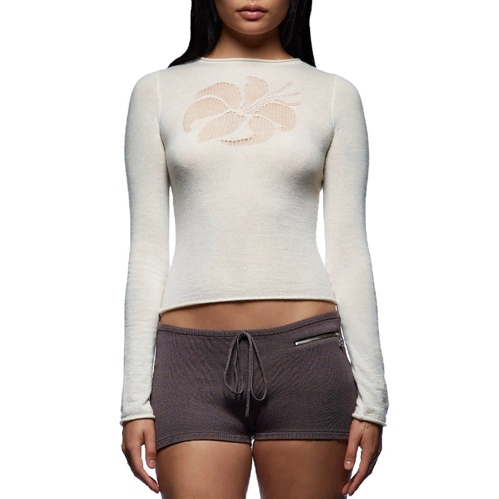 Person wearing a white long-sleeve top with a gray shorts