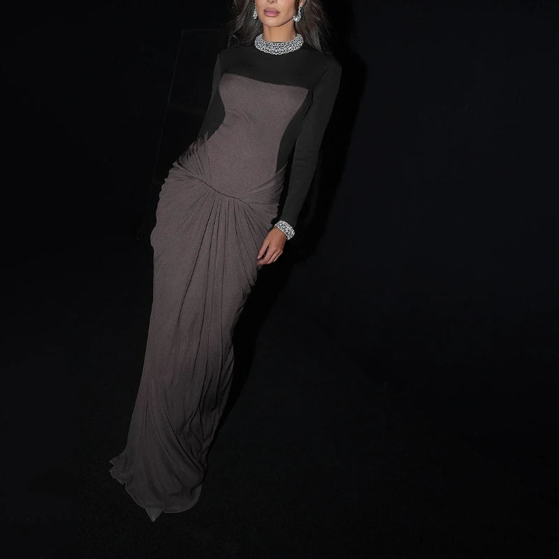 Sculpted panel evening dress shown with gathered waist drape.