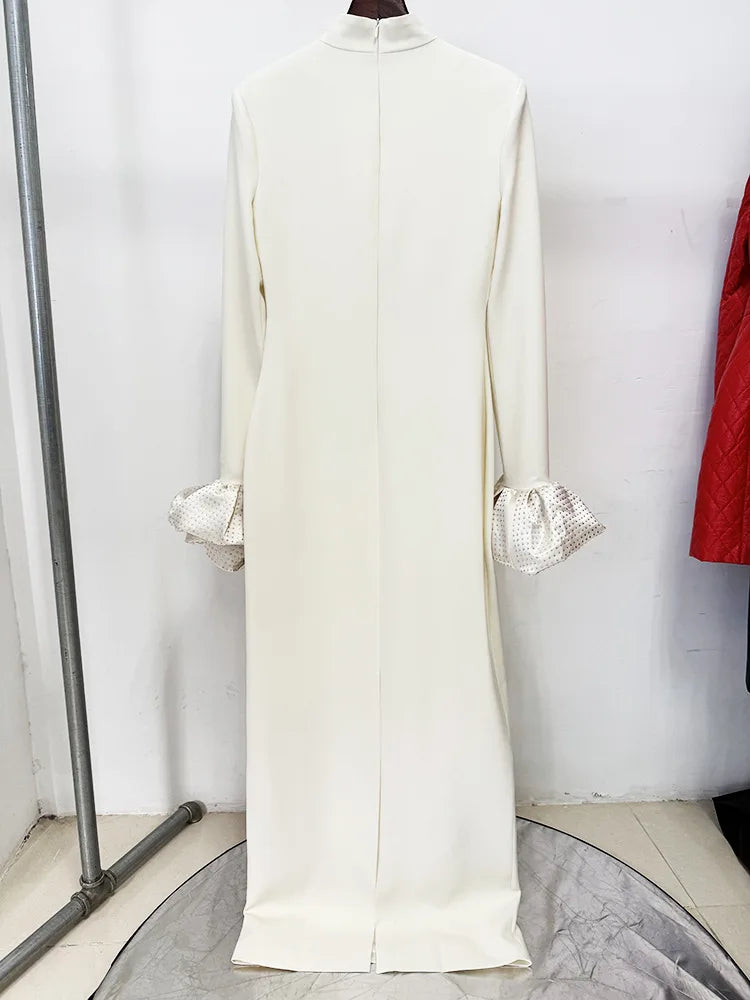 Back view of ivory high neck maxi dress with rhinestone puff sleeves