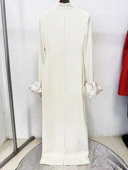 Back view of ivory high neck maxi dress with rhinestone puff sleeves