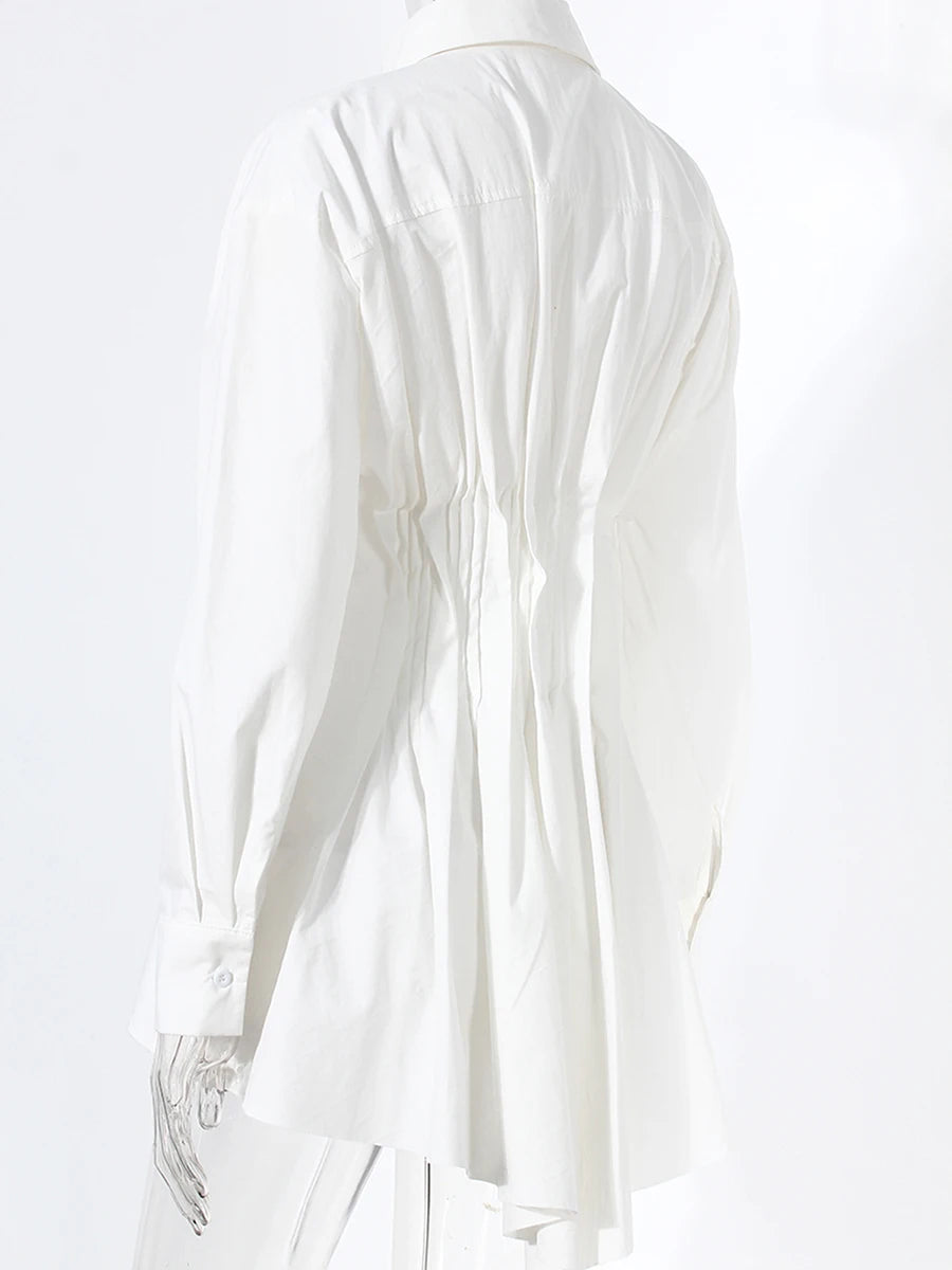 White blouse with ruffled details on a white background