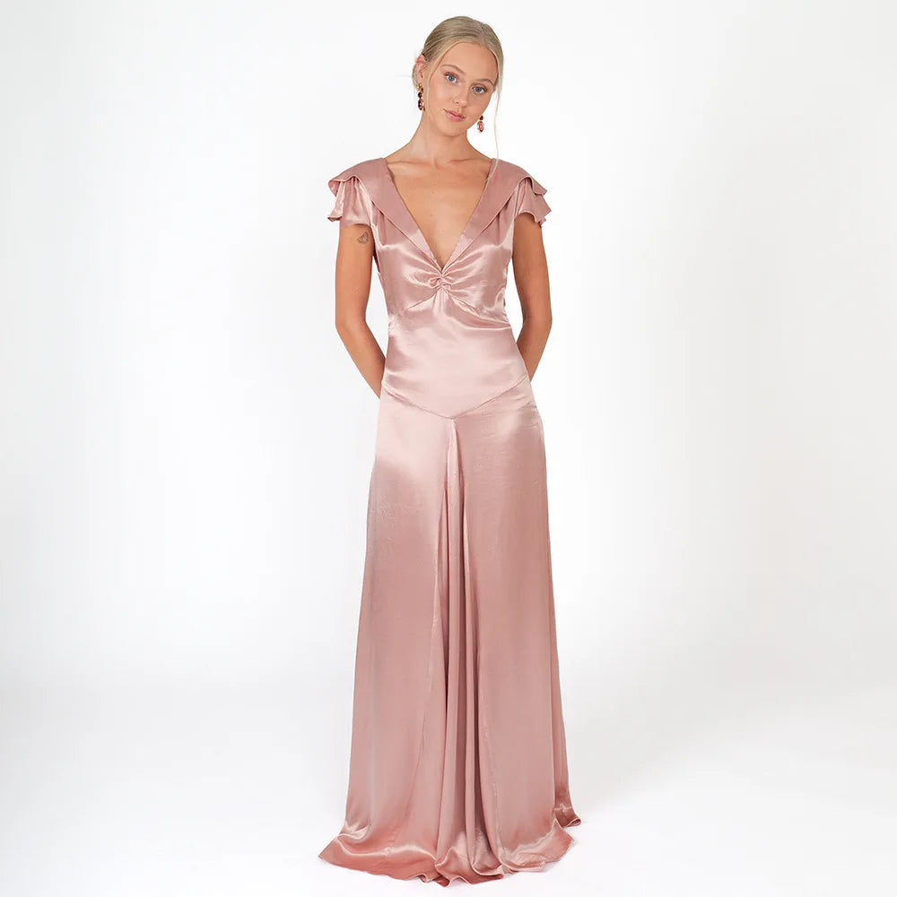 Pink satin evening gown with cap sleeves on a white background