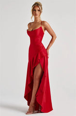 Woman wearing a red evening gown on a white background