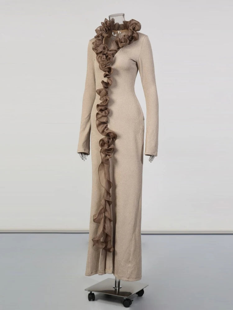 Beige dress with brown ruffled scarf on a mannequin against a white background