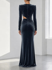 Velvet V-neck maxi dress with cut-out detail and high slit, back view.