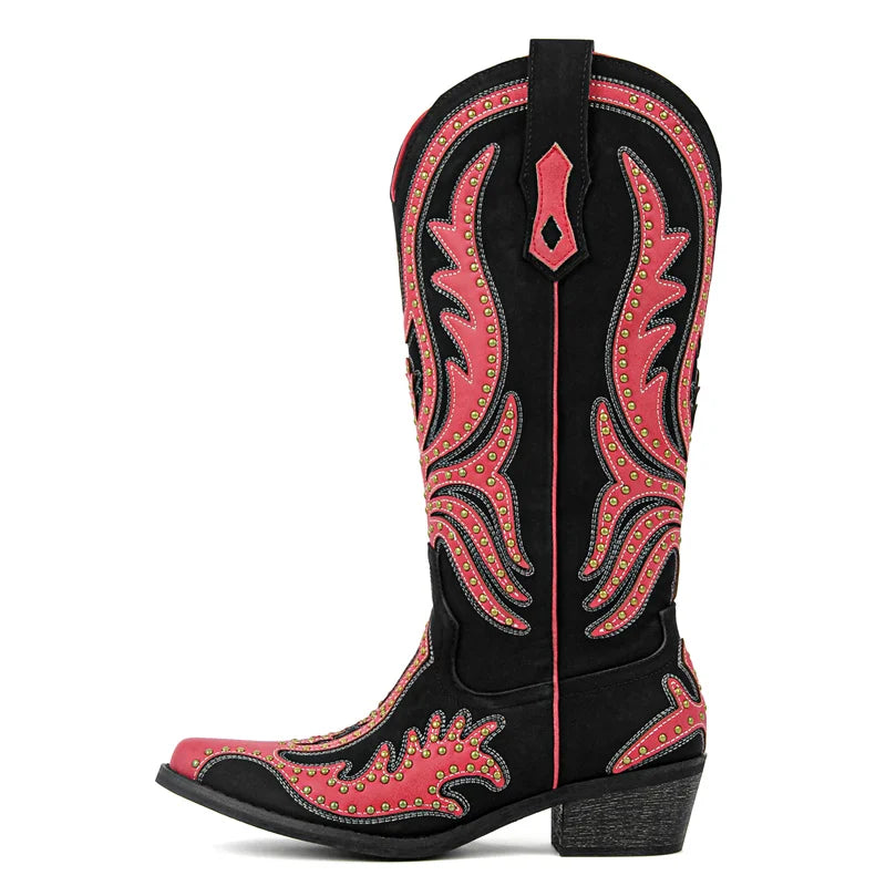 Black cowboy boot with red intricate patterns on a white background