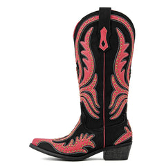 Black cowboy boot with red intricate patterns on a white background