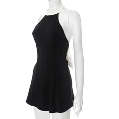 Black dress on a white mannequin against a white background