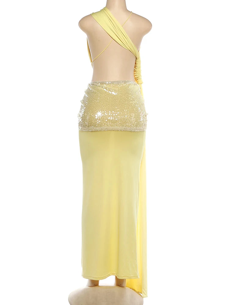Yellow dress with sequined top on a mannequin against a white background