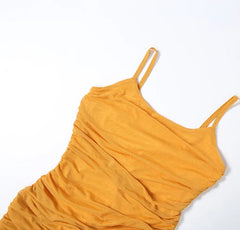 Yellow dress with thin straps on a white background