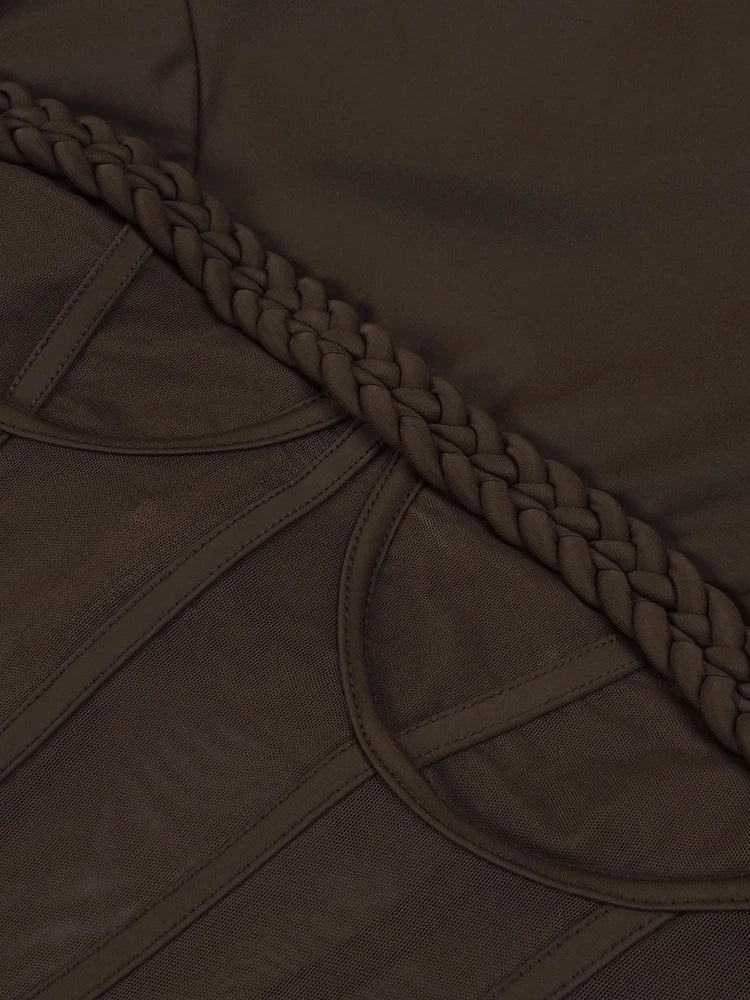 Close-up of a brown fabric with braided trim