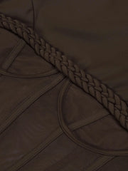Close-up of a brown fabric with braided trim
