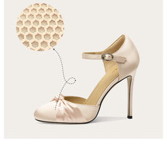 Beige high-heeled shoe with a close-up of the sole on a light background