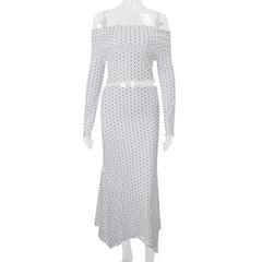 White off-shoulder dress with black polka dot pattern on a white background