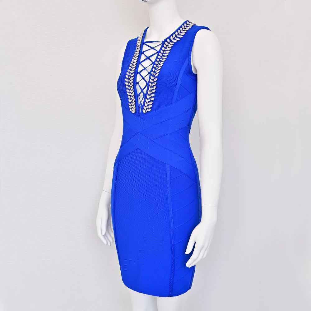 Blue dress with gold embellishments on a mannequin against a white background