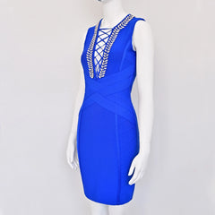Blue dress with gold embellishments on a mannequin against a white background