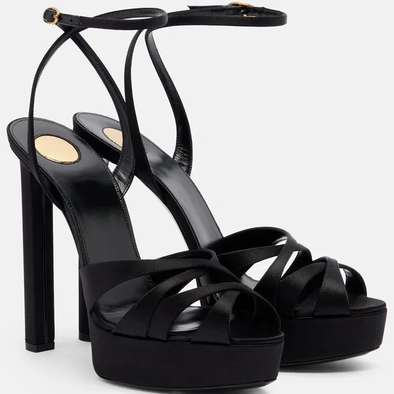 Black platform block heel sandals with crisscross straps and ankle buckle