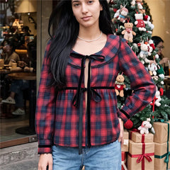 Red plaid long sleeve peplum top with velvet bow tie and Peter Pan collar on model