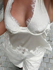 White lace lingerie set on a textured surface