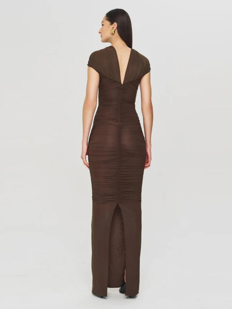 Brown evening gown with a deep neckline on a white background