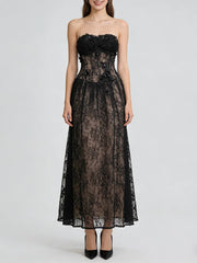 Black lace strapless dress on a white background