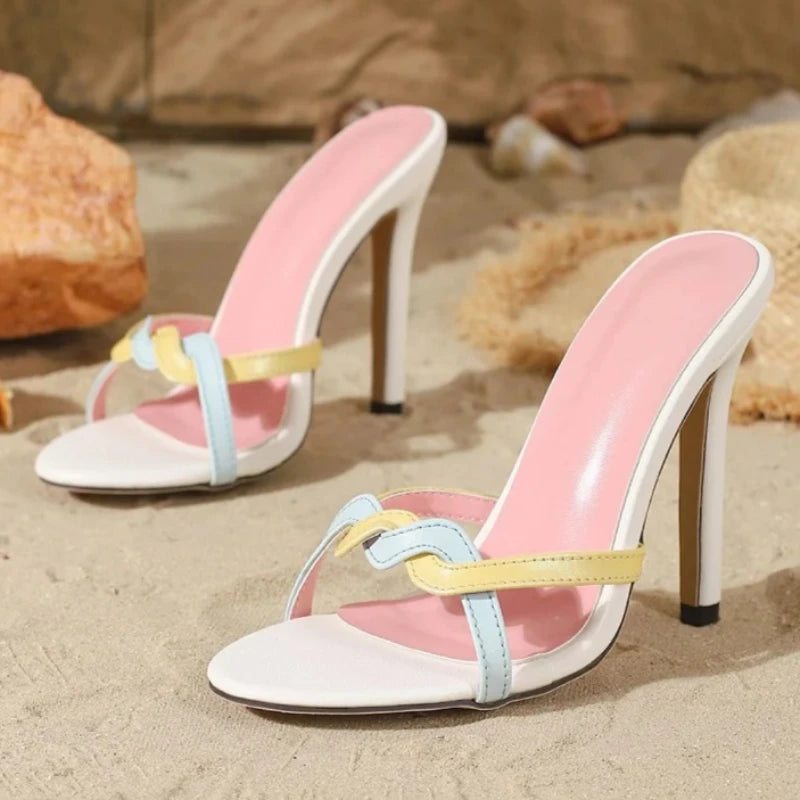 Multi-strap stiletto heels on sand