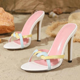 Multi-strap stiletto heels on sand