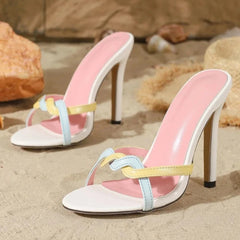 Multi-strap stiletto heels on sand