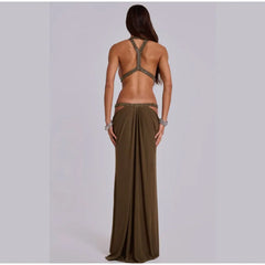 Woman wearing a long olive green dress with a backless top on a light gray background