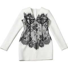 White jacket with black lace detailing on a white background