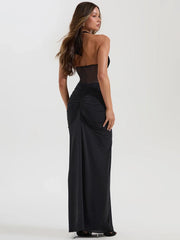 Woman wearing a black evening gown- back