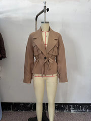The beige trench coat on a mannequin