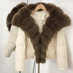 Beige puffer jacket with brown fur collar on a hanger against a white background