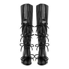 Black pointed toe knee high boots with bow detail and block heel