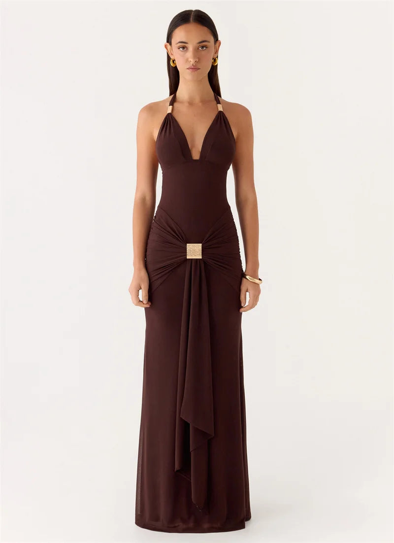 Woman wearing a brown evening gown on a white background