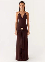 Woman wearing a brown evening gown on a white background