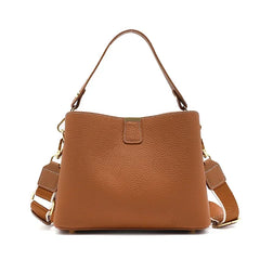 Brown leather handbag with a shoulder strap on a white background