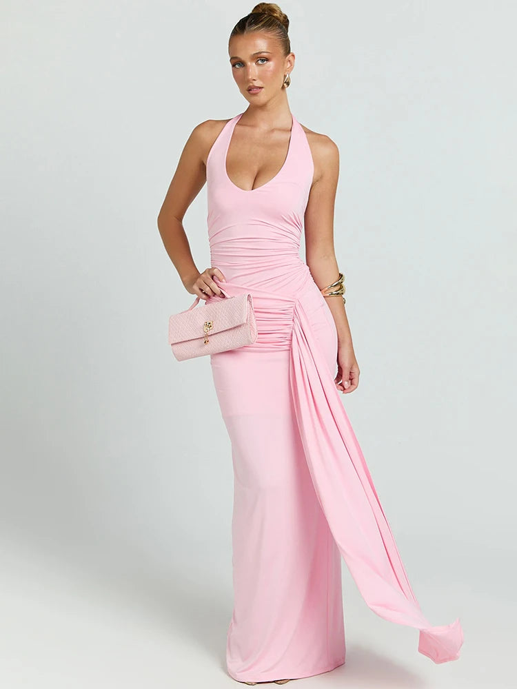 Woman wearing a pink evening gown with a white background